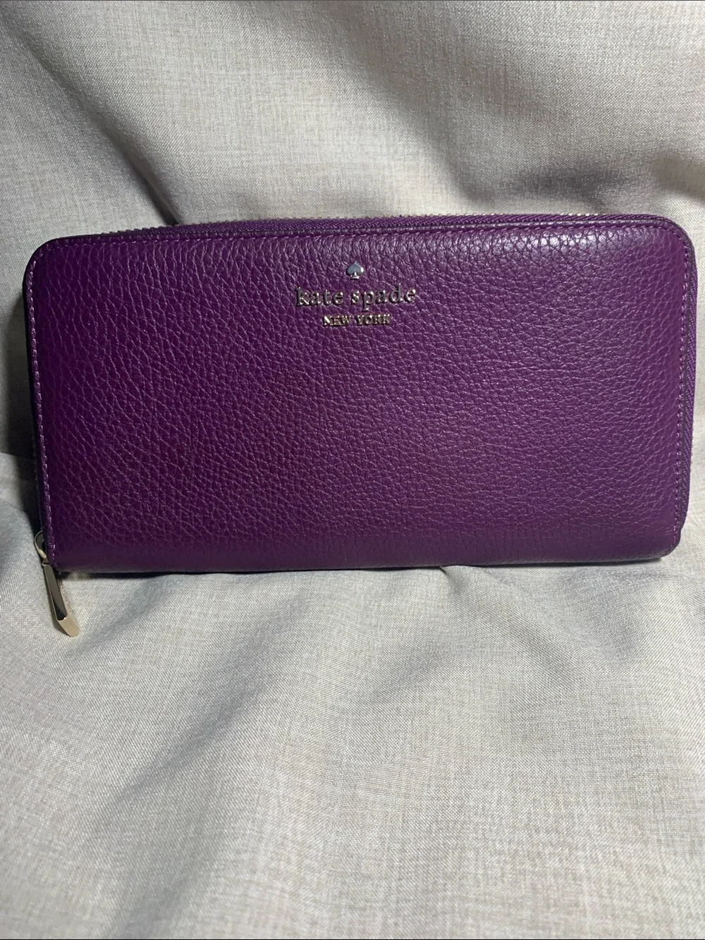 kate spade deep purple pebbled leather zip wallet